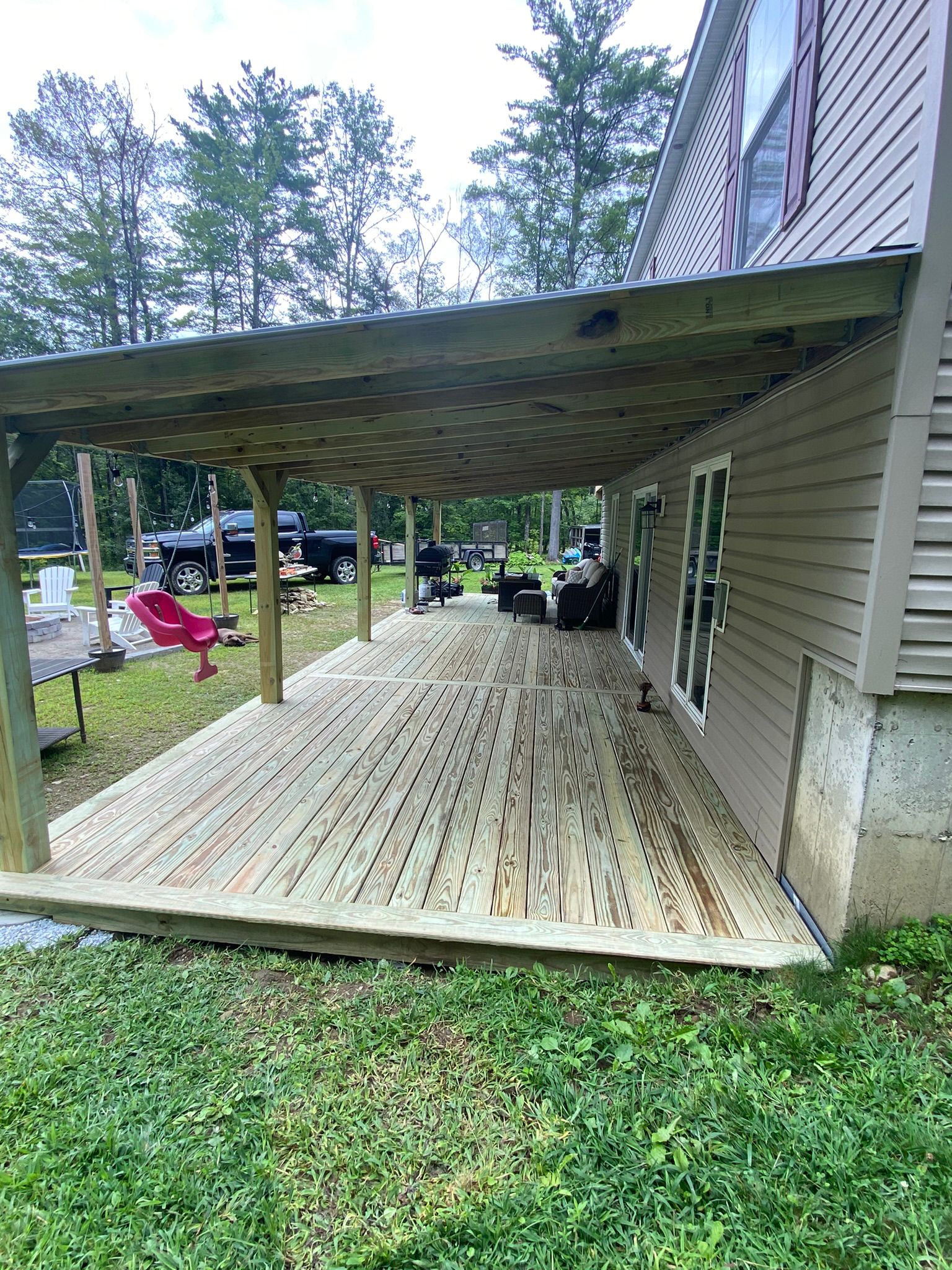 Covered patio with composite decking and structural roof support