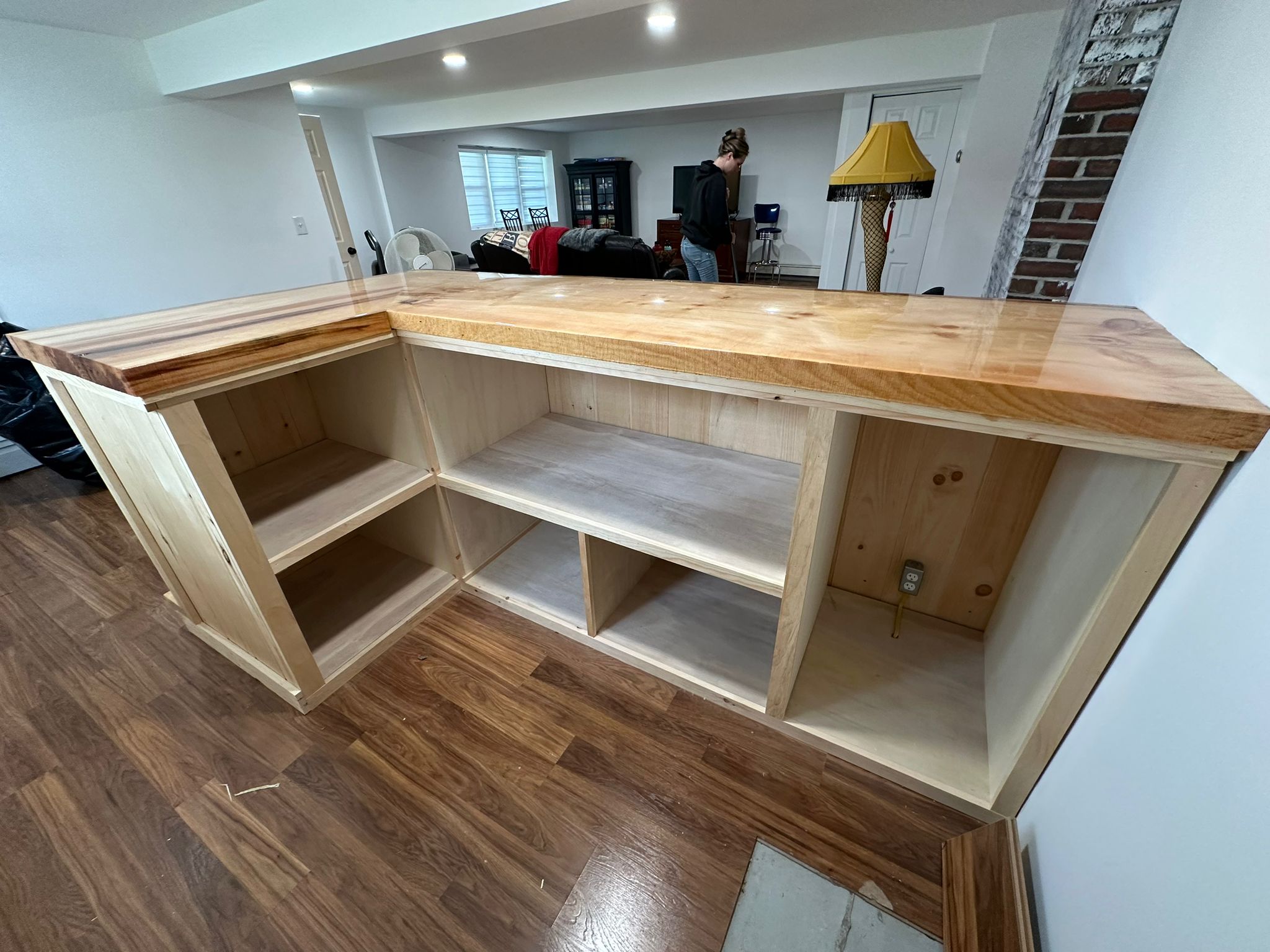 Interior view of custom bar showing detailed craftsmanship and storage