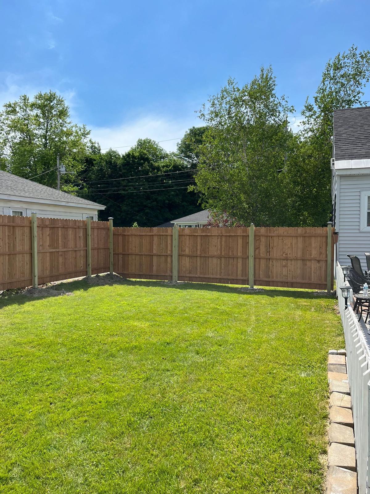 Corner section of wooden fence with clean lines and professional installation