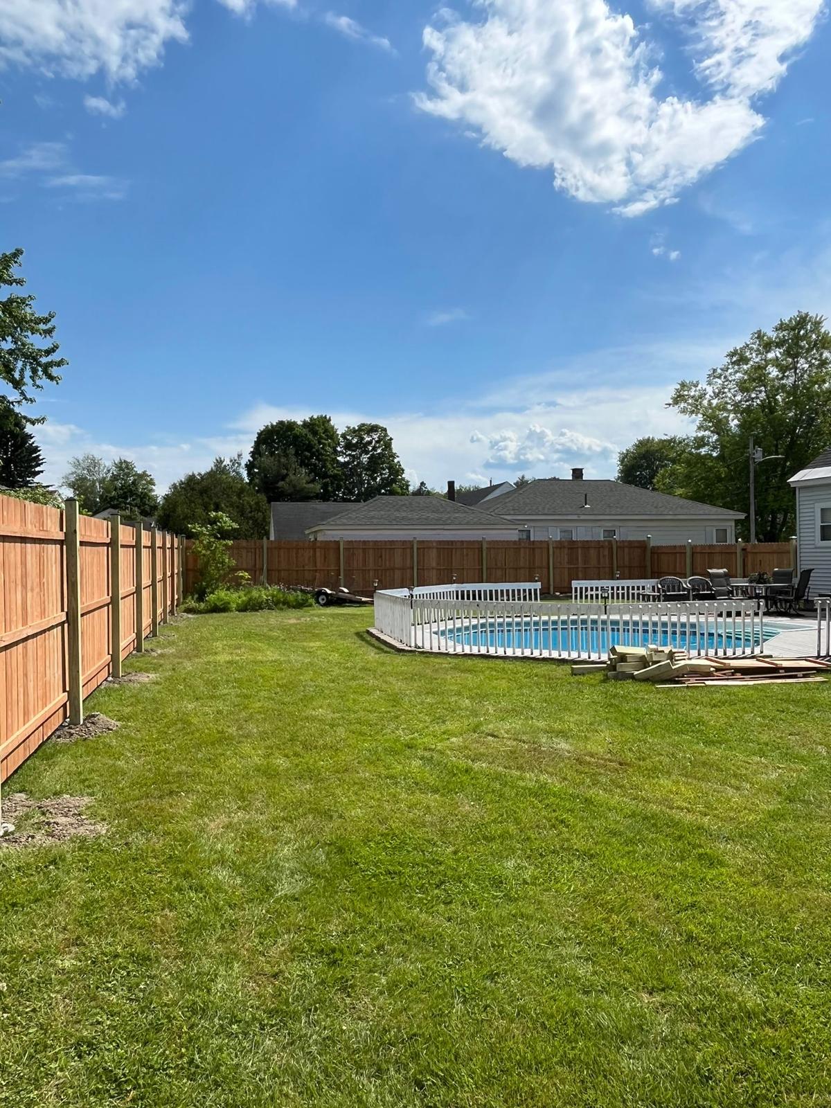 Complete pool area fencing project showing full perimeter installation