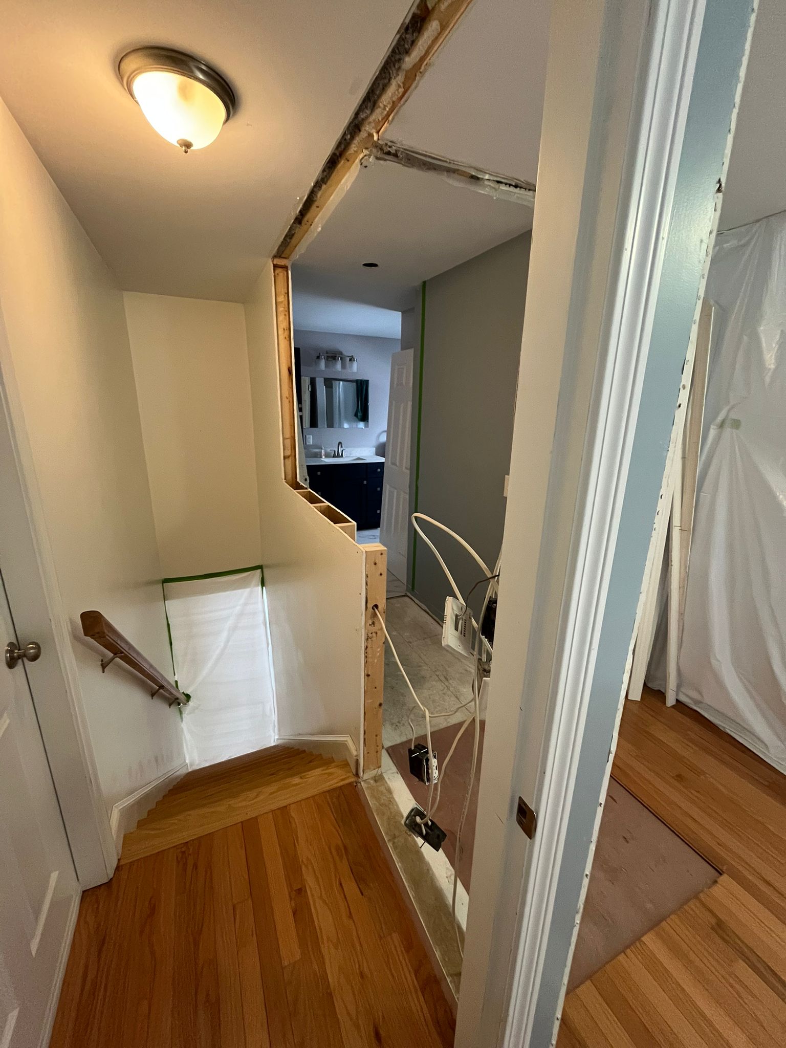 Before - Interior renovation showing exposed beams and construction in progress