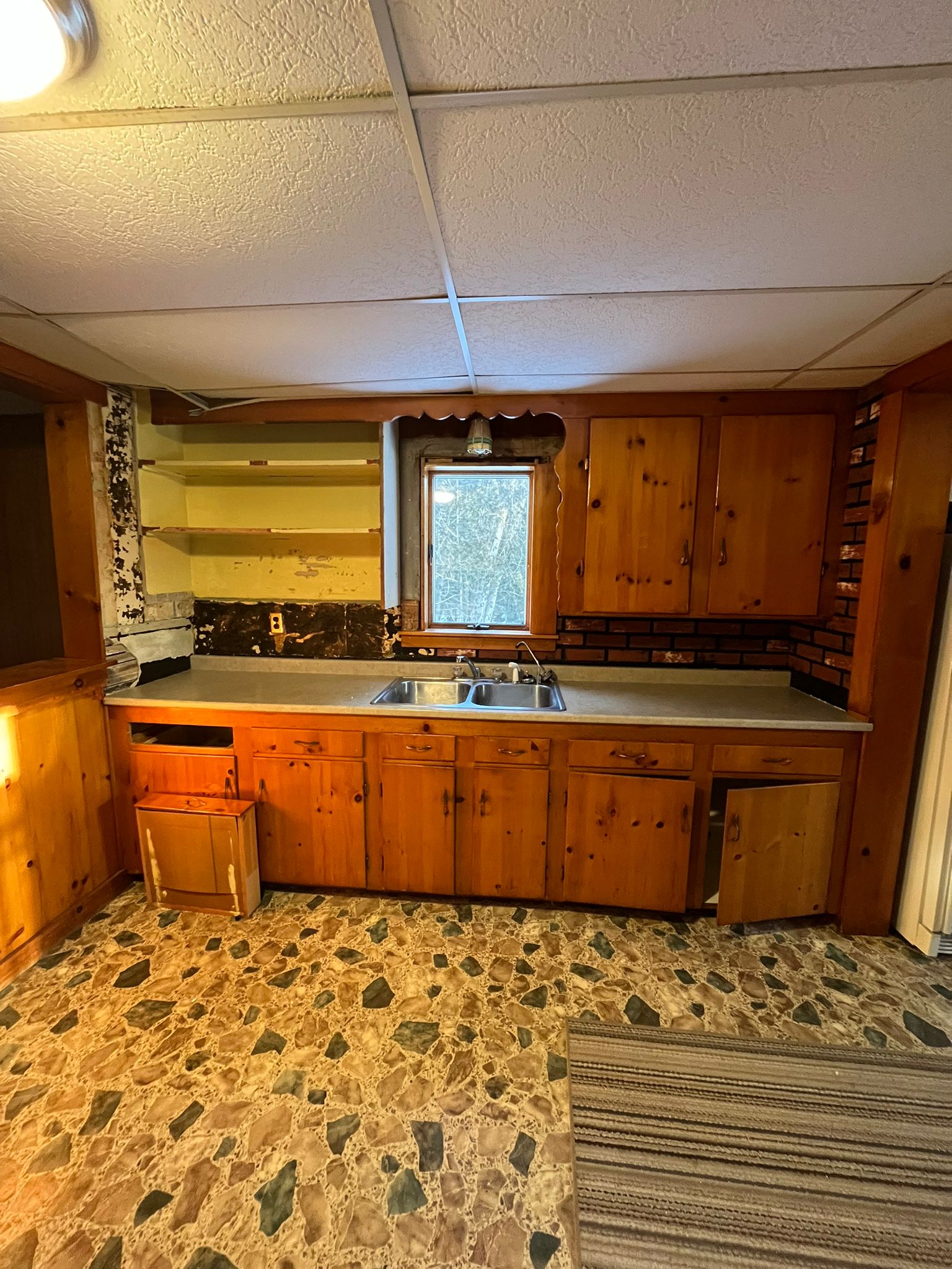 Before - Kitchen with drop ceiling and older cabinets
