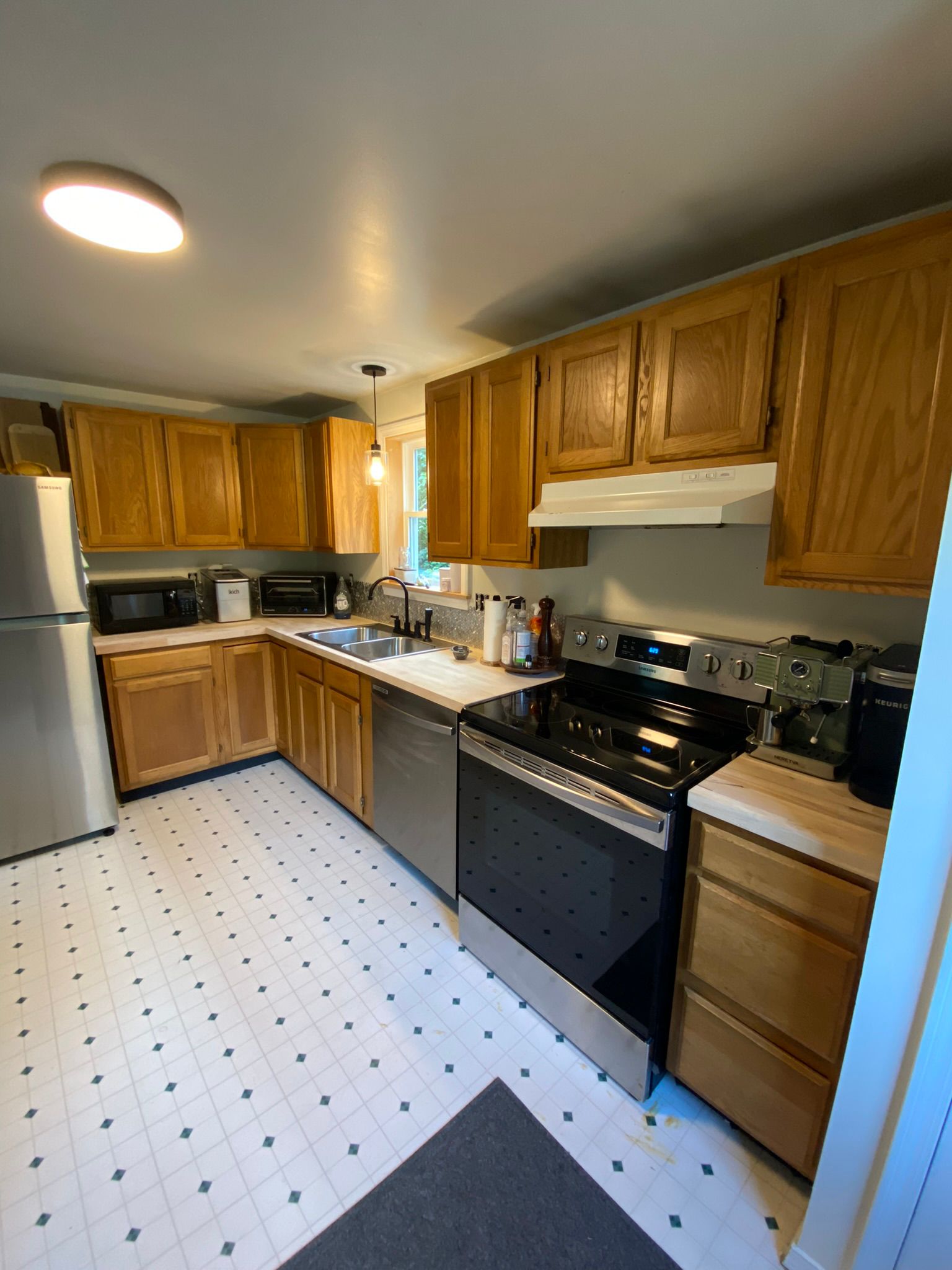Complete kitchen renovation with oak cabinets and modern appliances